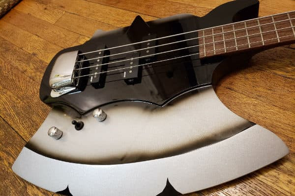 Mahogany body of the Cort Gene Simmons Axe Bass guitar.