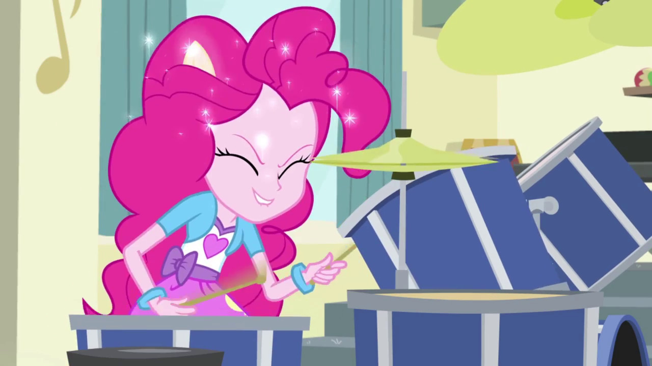 Pinkie Pie with pony ears popping out in Pinkie on the One, a My Little Pony Equestria Girls Rainbow Rocks short focused on her drumming energy.