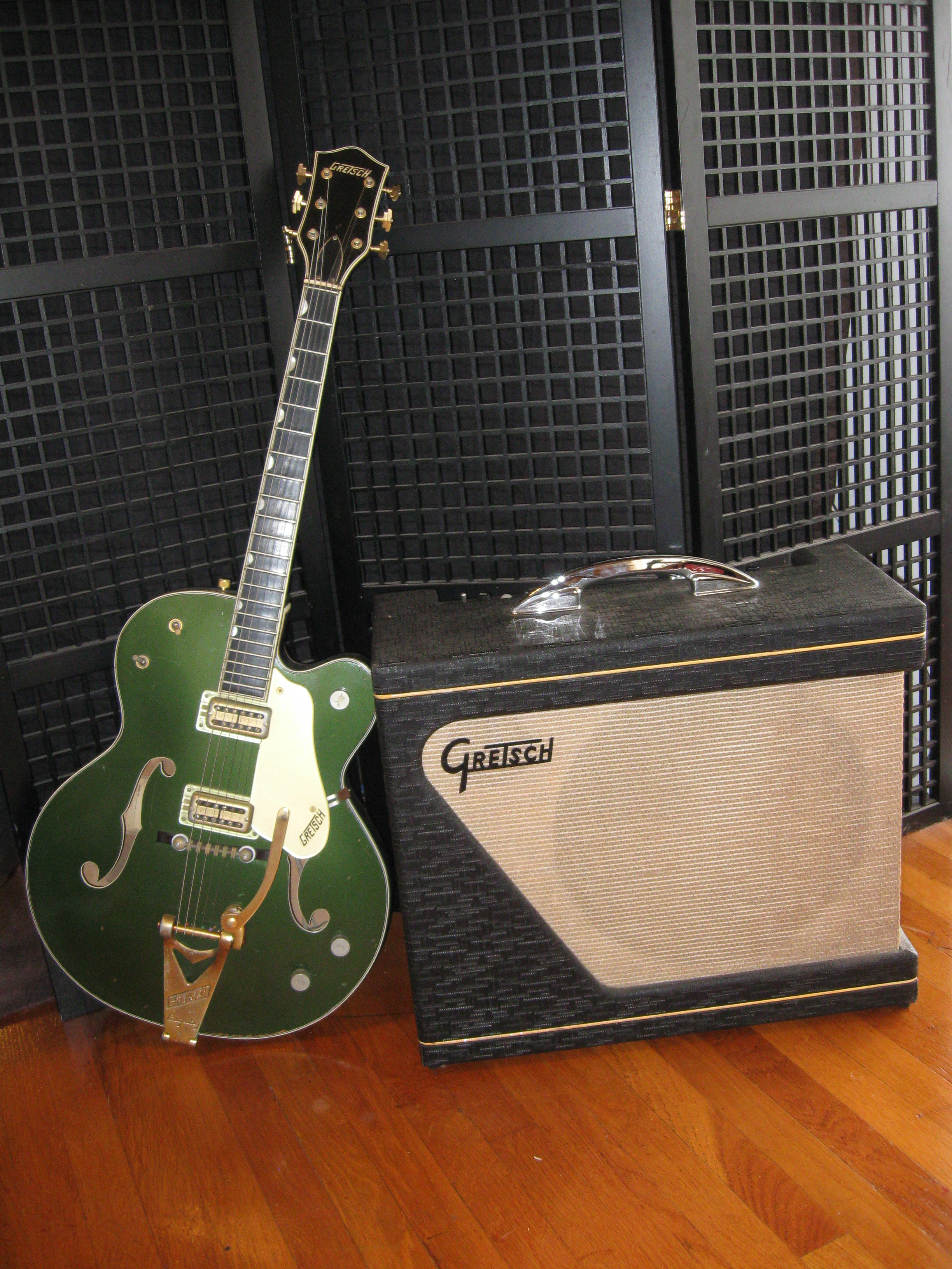 Close-up of a vintage electric guitar hanging on a wall in a guitar store, highlighting the craftsmanship and detail.