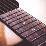 Guitar strings close up showing dirt