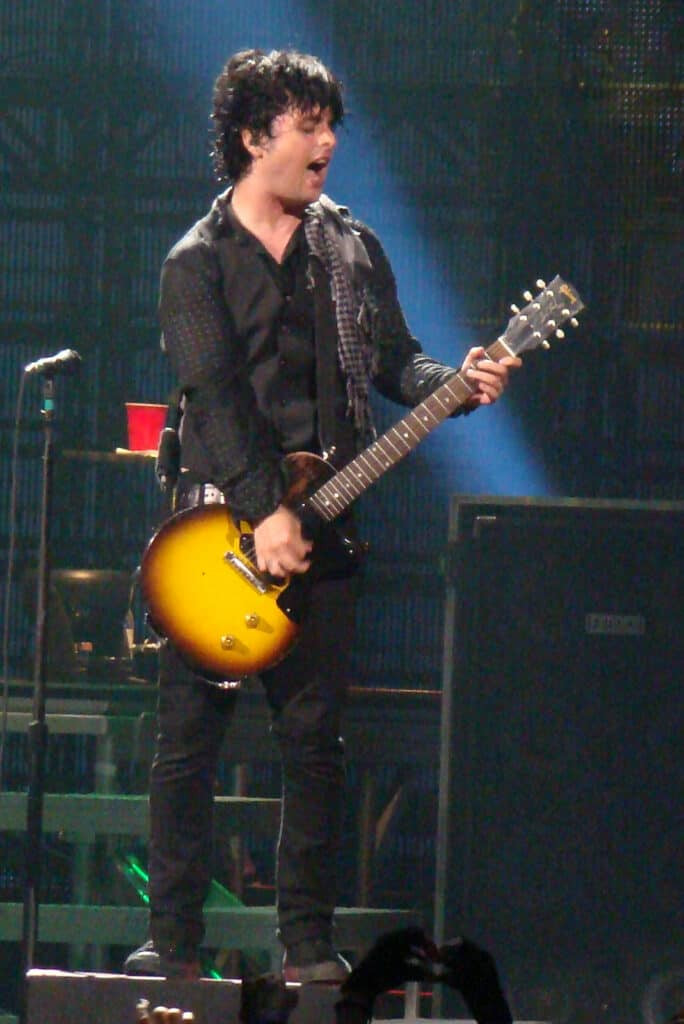 Billie Joe Armstrong energetically performing live with his 1956 Gibson Les Paul Junior &quot;Floyd&quot;, a favorite stage and studio guitar.