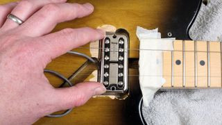 Guitar body routing to accommodate a humbucker pickup, demonstrating a modification process for pickup installation