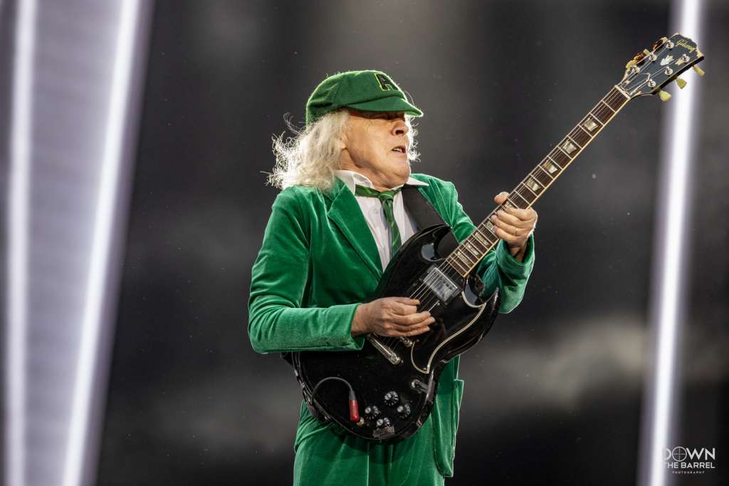 AC/DC performing &quot;Riff Raff&quot; with Angus Young center stage playing guitar.