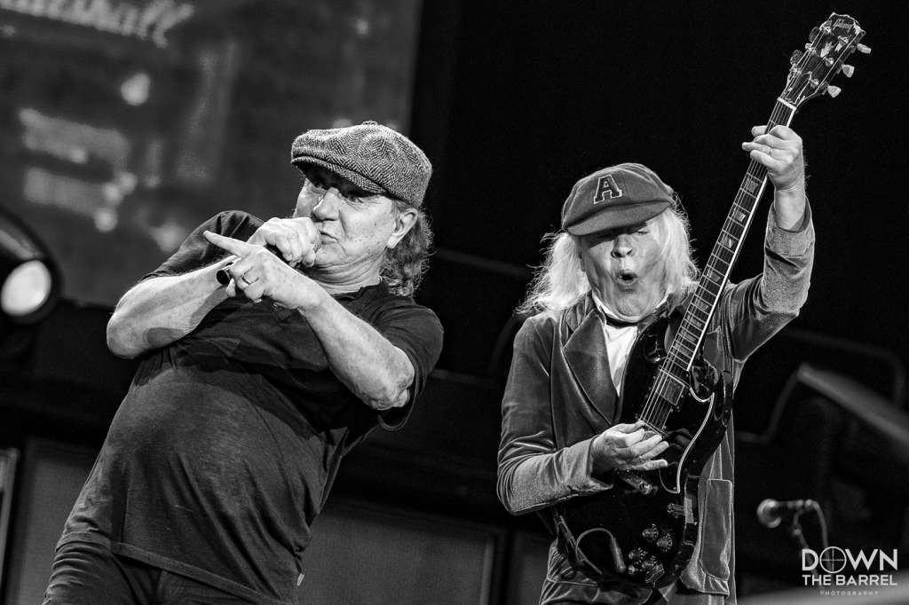 AC/DC performing &quot;Dirty Deeds Done Dirt Cheap&quot; with Angus Young center stage.