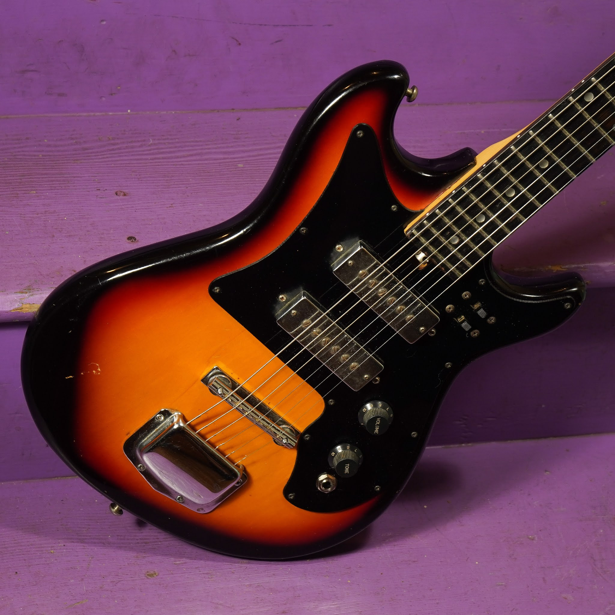 Full body shot of the restored Harmony electric guitar, highlighting its compact size and overall condition after restoration.