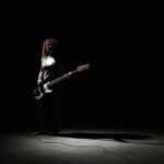 Bass Guitarist in Shadows