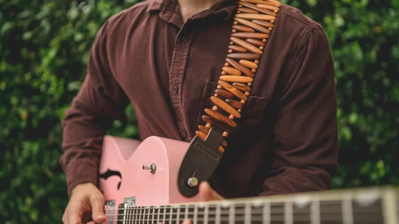 Revo handmade wooden guitar strap, a unique and comfortable gift for guitar players who appreciate craftsmanship.