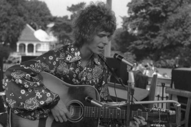 David Bowie performing live at the Beckenham Free Festival in 1969, playing his Hagstrom 12-string acoustic guitar
