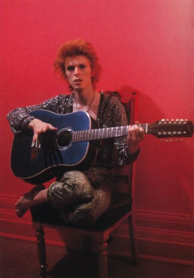 David Bowie holding his blue Egmond 12-string guitar