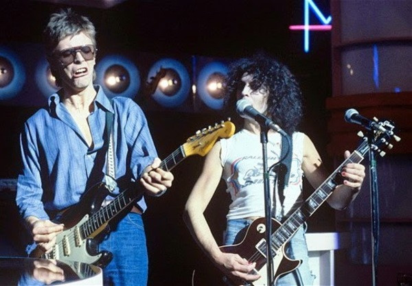 David Bowie with a Fender Stratocaster alongside Marc Bolan