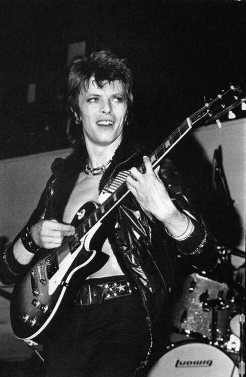 David Bowie playing a Gibson Les Paul guitar