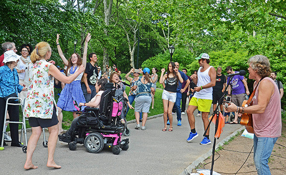 More dancing at a performance, emphasizing the lively audience participation