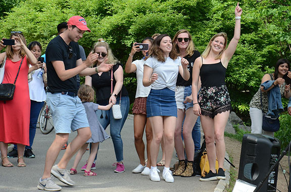 Further evidence of dancing at a June performance, highlighting audience joy and participation