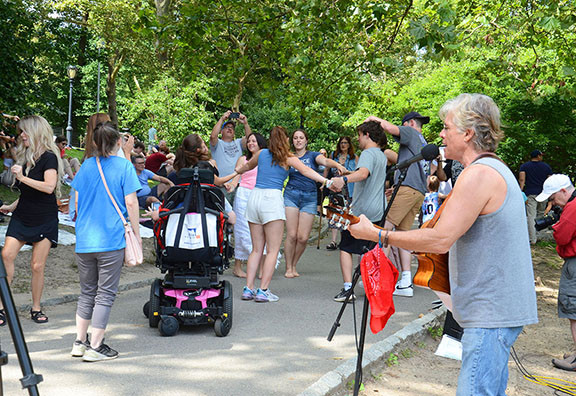 People dancing and enjoying the music at a Central Park performance