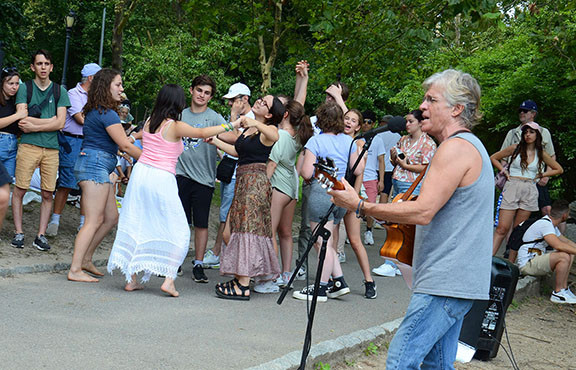 Etgar dancing at &quot;The Hill,&quot; reflecting the joyful and expressive audience participation