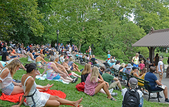 A crowd enjoying a past performance, representative of the shared experiences with the audience