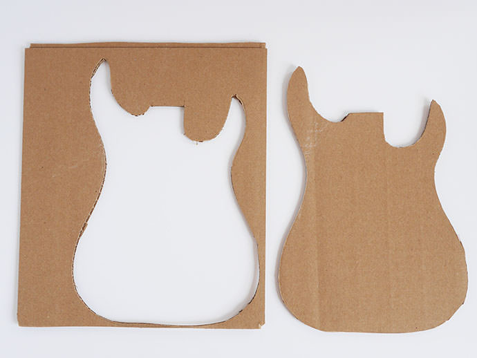 Step 1: Tracing the guitar template onto cardboard using a pencil