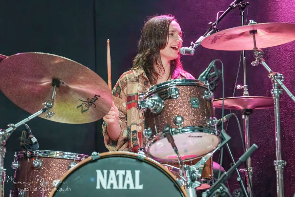 Cody Moss playing keys with energy, adding to the band's dynamic performance