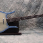 Evets '90s Danelectro Longhorn Bass guitar in sky blue finish, showcasing its unique body shape and design