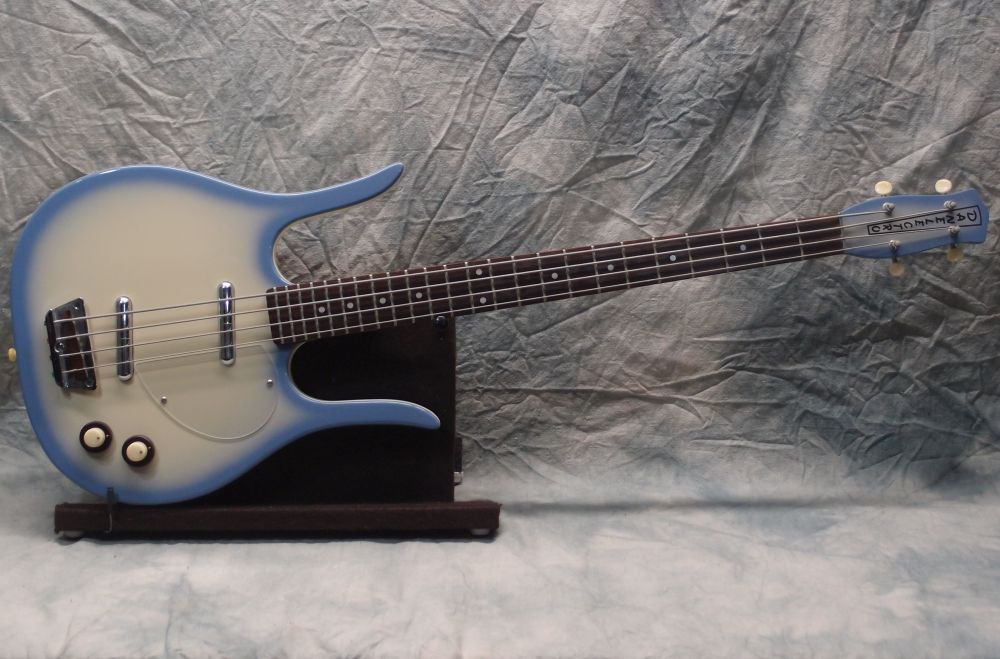 Evets '90s Danelectro Longhorn Bass guitar in sky blue finish, showcasing its unique body shape and design