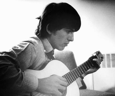 George Harrison playing his José Ramírez classical guitar