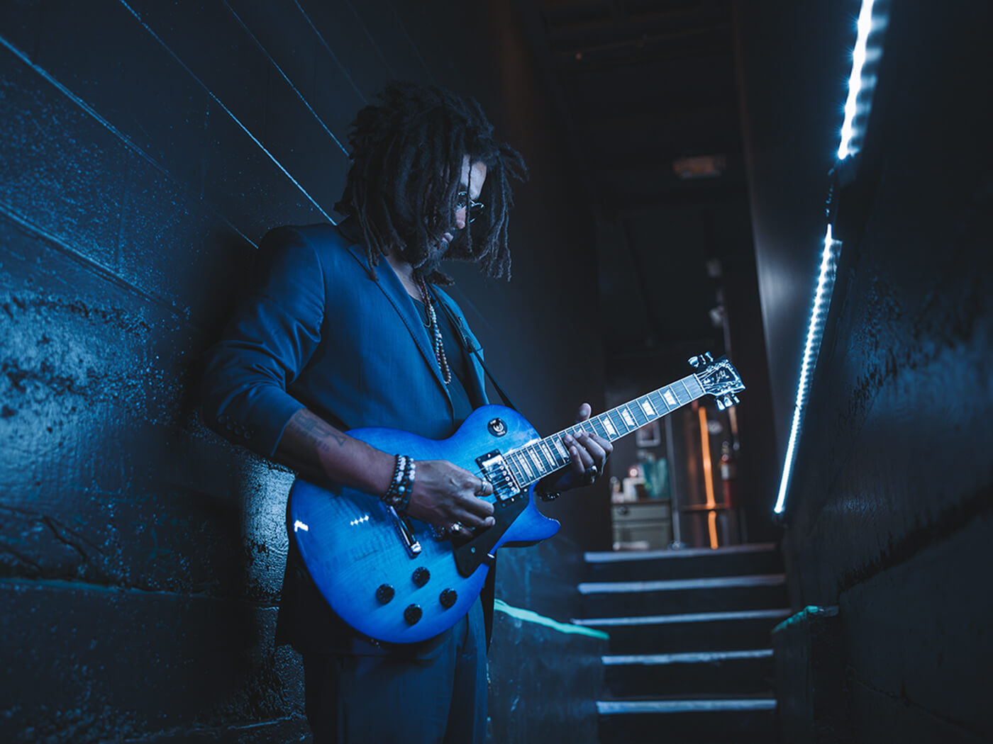 A guitarist playing the Studio Session in Cobalt Burst, photo by press