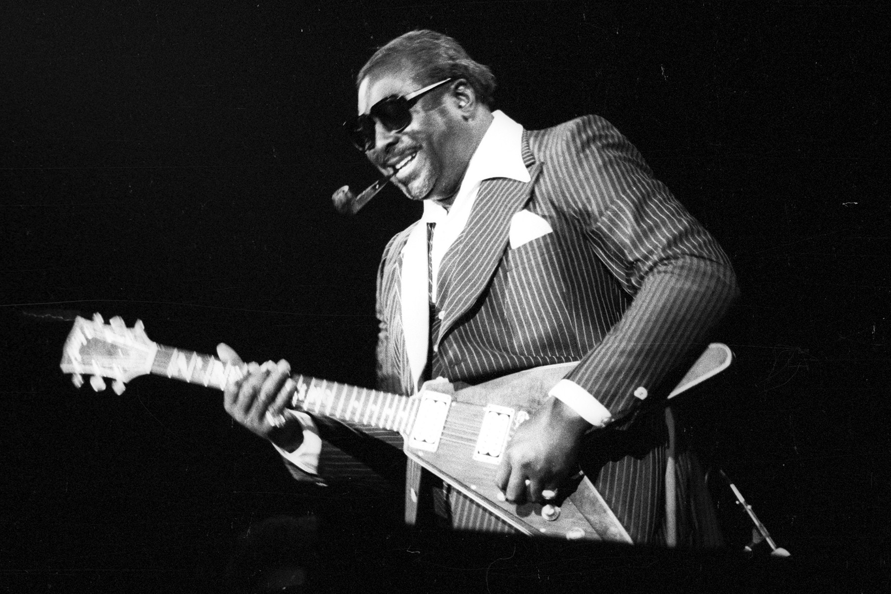 Albert King in a portrait from circa 1970, showcasing his powerful string bending and unique upside-down guitar style