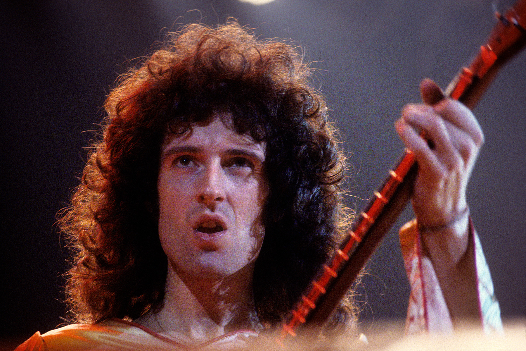 Brian May of Queen performing in Oakland, 1978, playing his homemade Red Special guitar and showcasing his layered harmonies