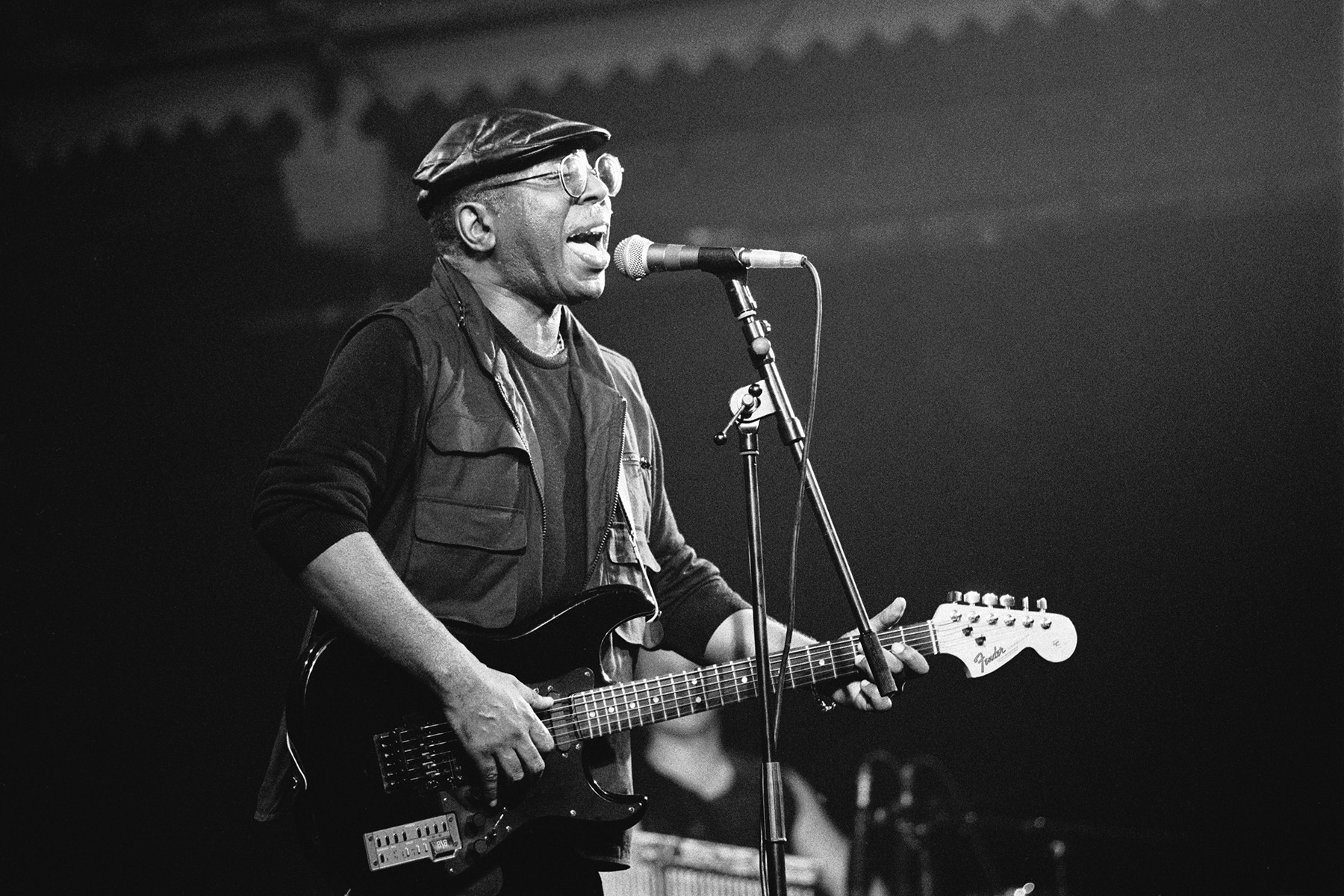Curtis Mayfield singing and playing guitar at Paradiso, Amsterdam in 1990, showcasing his soulful and melodic guitar style