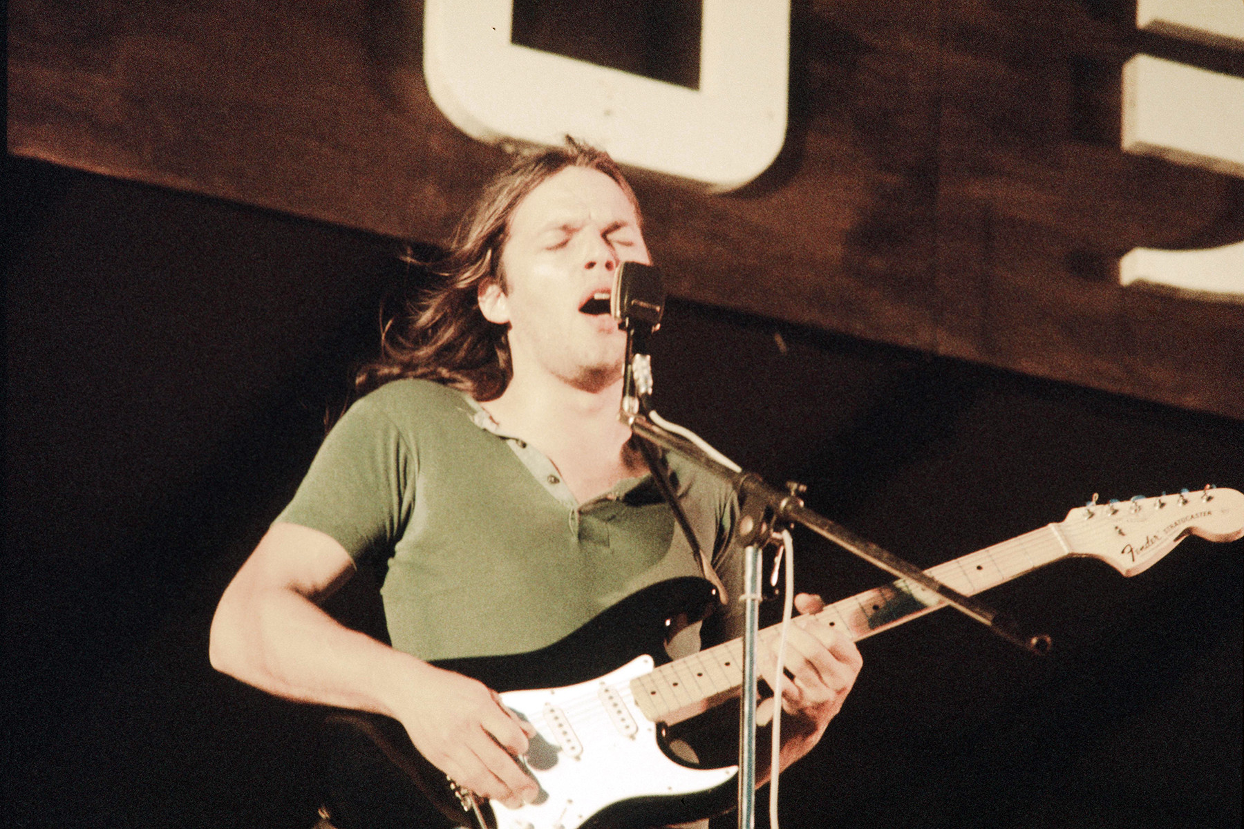 David Gilmour of Pink Floyd playing at Hakone Aphrodite, 1971, showcasing his melodic and atmospheric guitar style