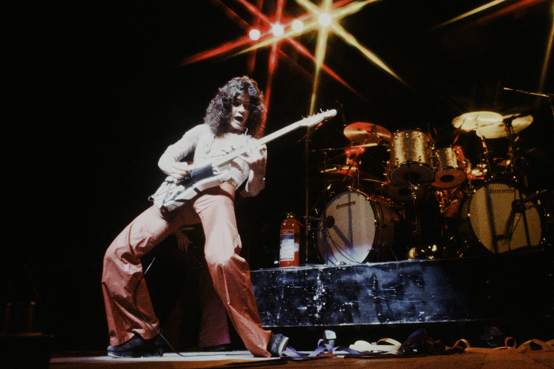 Eddie Van Halen performing in Tokyo, 1978, showcasing his revolutionary tapping technique and his high-energy stage presence