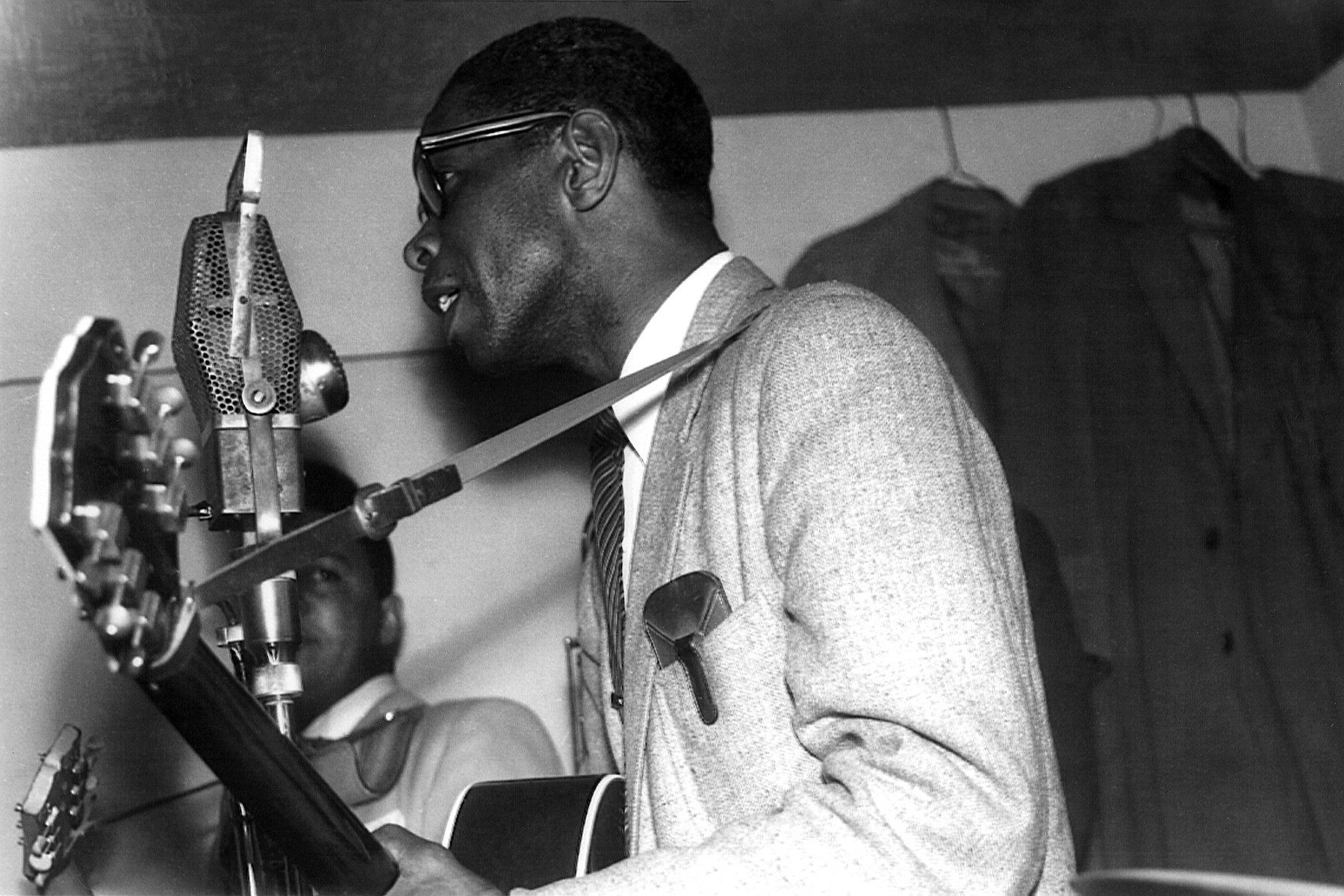 Elmore James playing blues guitar, showcasing his slide technique and electric pickup, circa 1960