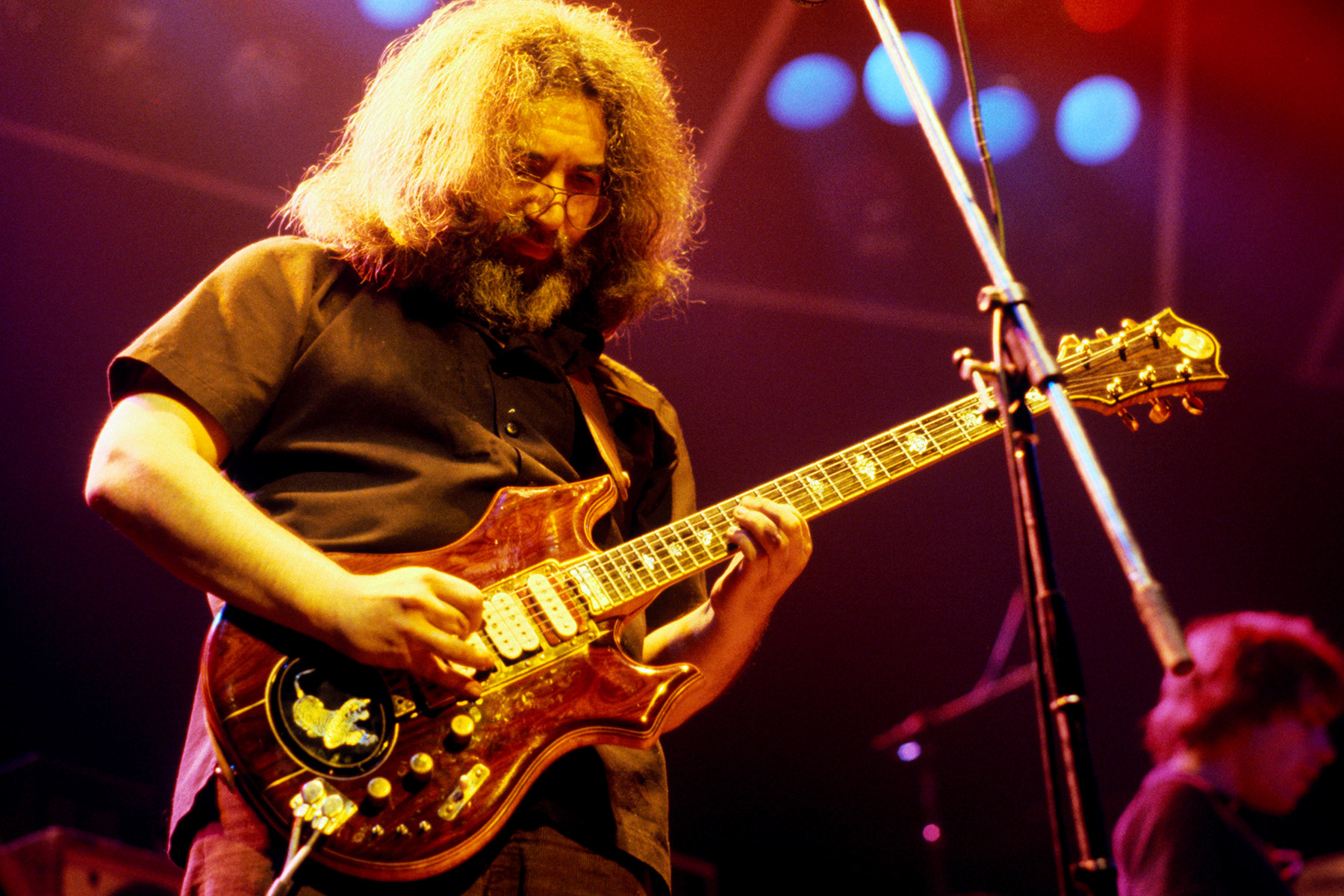 Jerry Garcia of The Grateful Dead performing in London, 1972, showcasing his improvisational and psychedelic guitar style