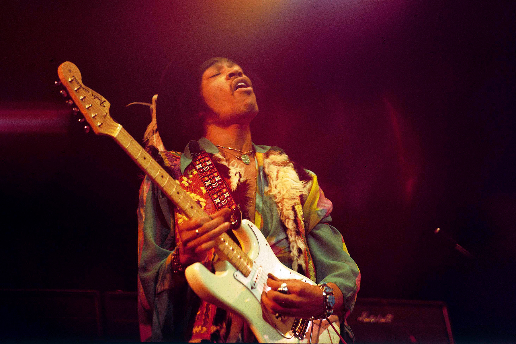 Jimi Hendrix performing at Royal Albert Hall, 1969, lighting the way for future guitarists and solidifying his place as the greatest of all time