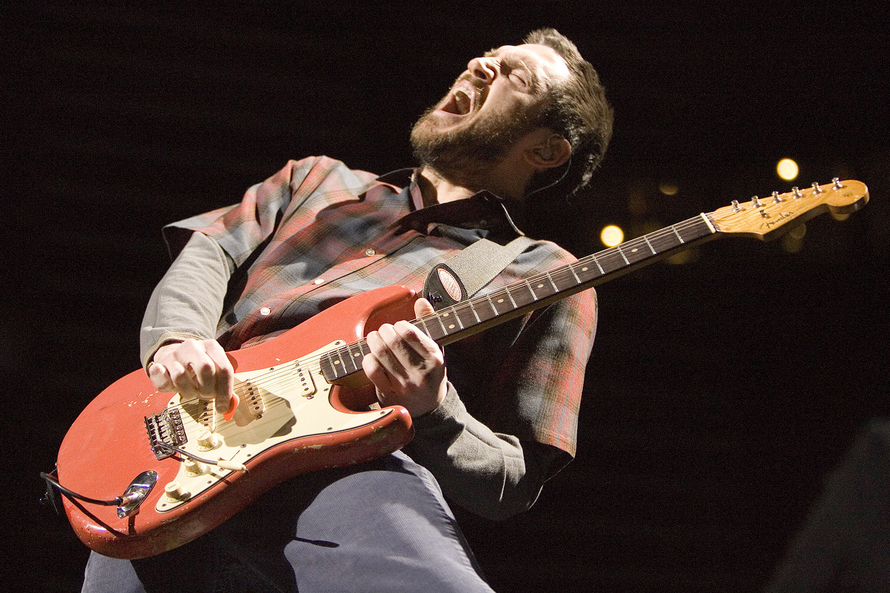 John Frusciante of Red Hot Chili Peppers performing in 2007, showcasing his eclectic guitar style and his role in shaping the band's sound