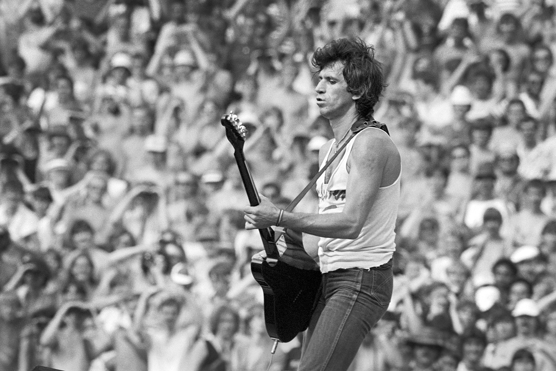 Keith Richards of The Rolling Stones performing in Rotterdam, 1982, showcasing his riff-based guitar style and effortless cool