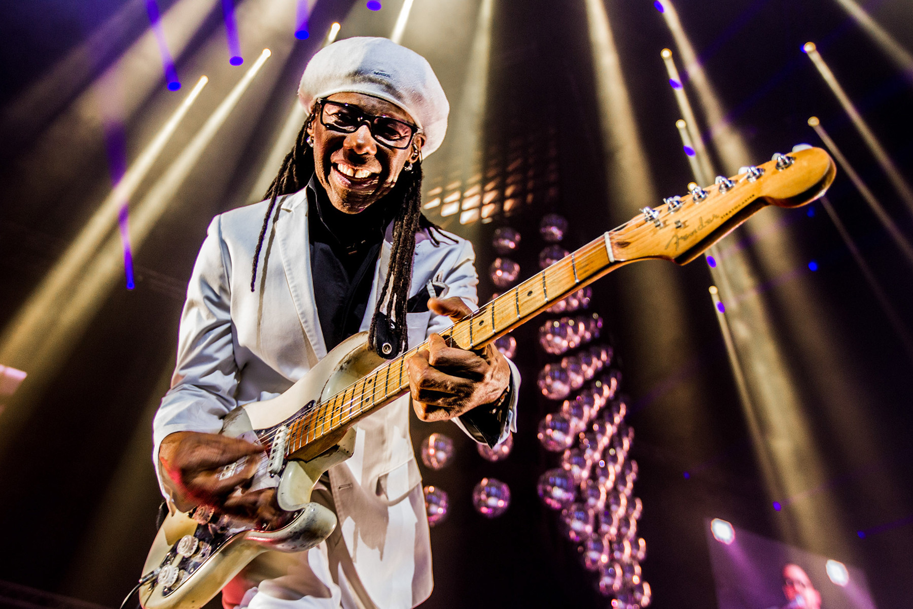 Nile Rodgers performing in his Let's Dance suit, showcasing his massively influential funk guitar style and his signature &quot;chucking&quot;