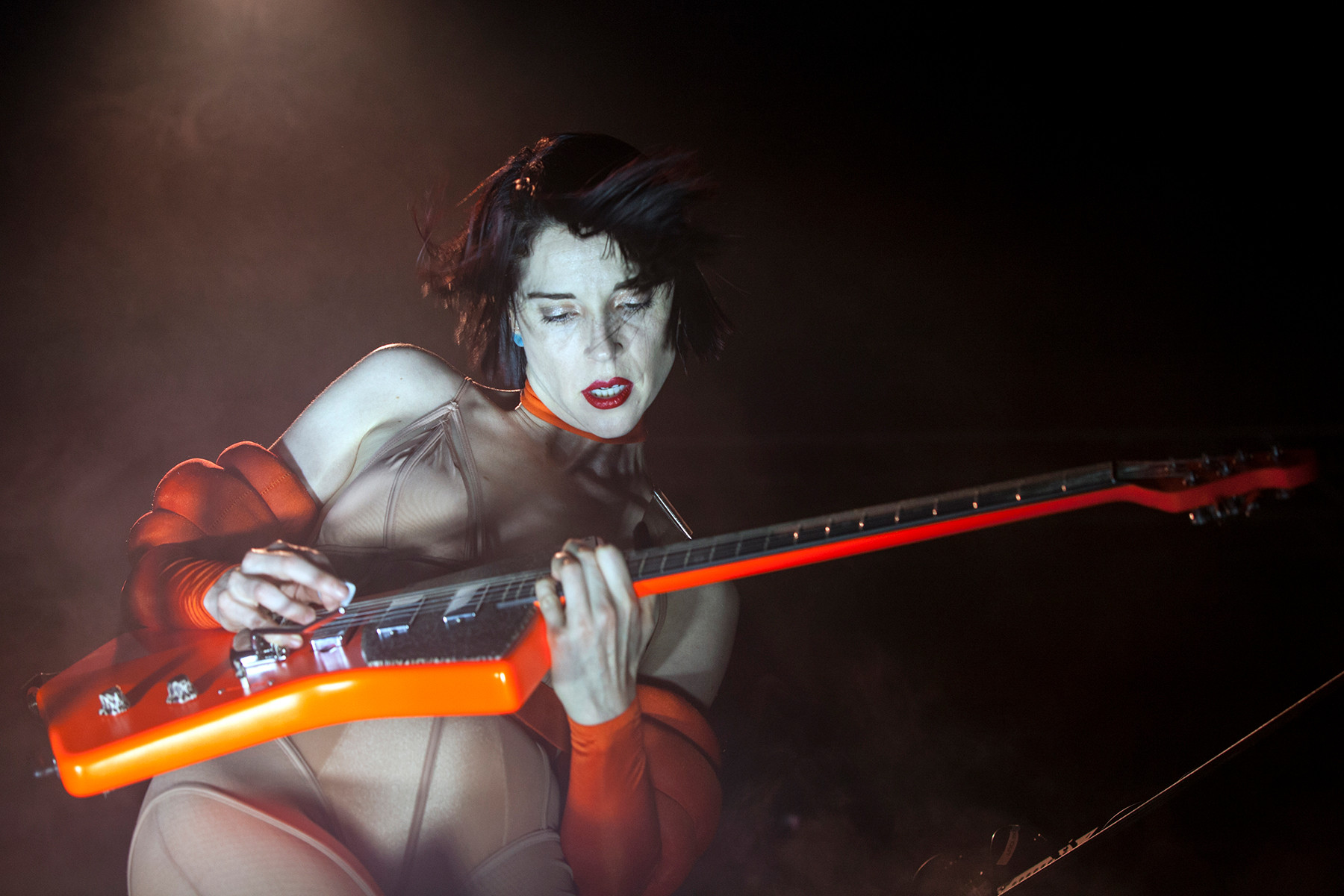 St. Vincent performing in Charlotte, NC, 2018, showcasing her innovative and textural guitar approach within her complex music