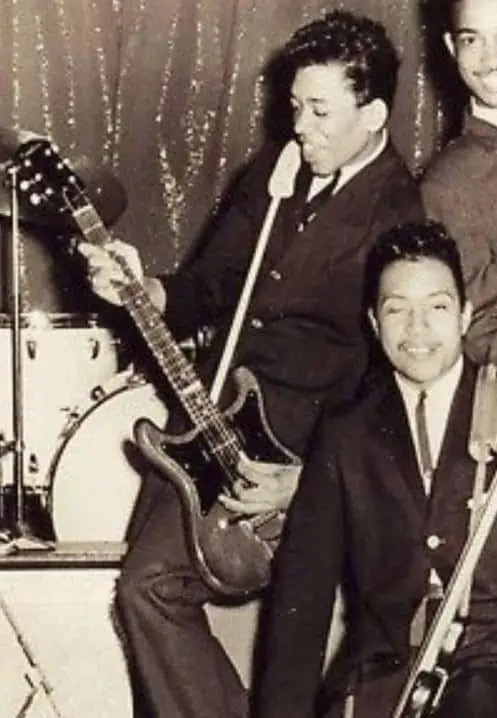 A young Jimi Hendrix playing his Epiphone Wilshire guitar in his early career