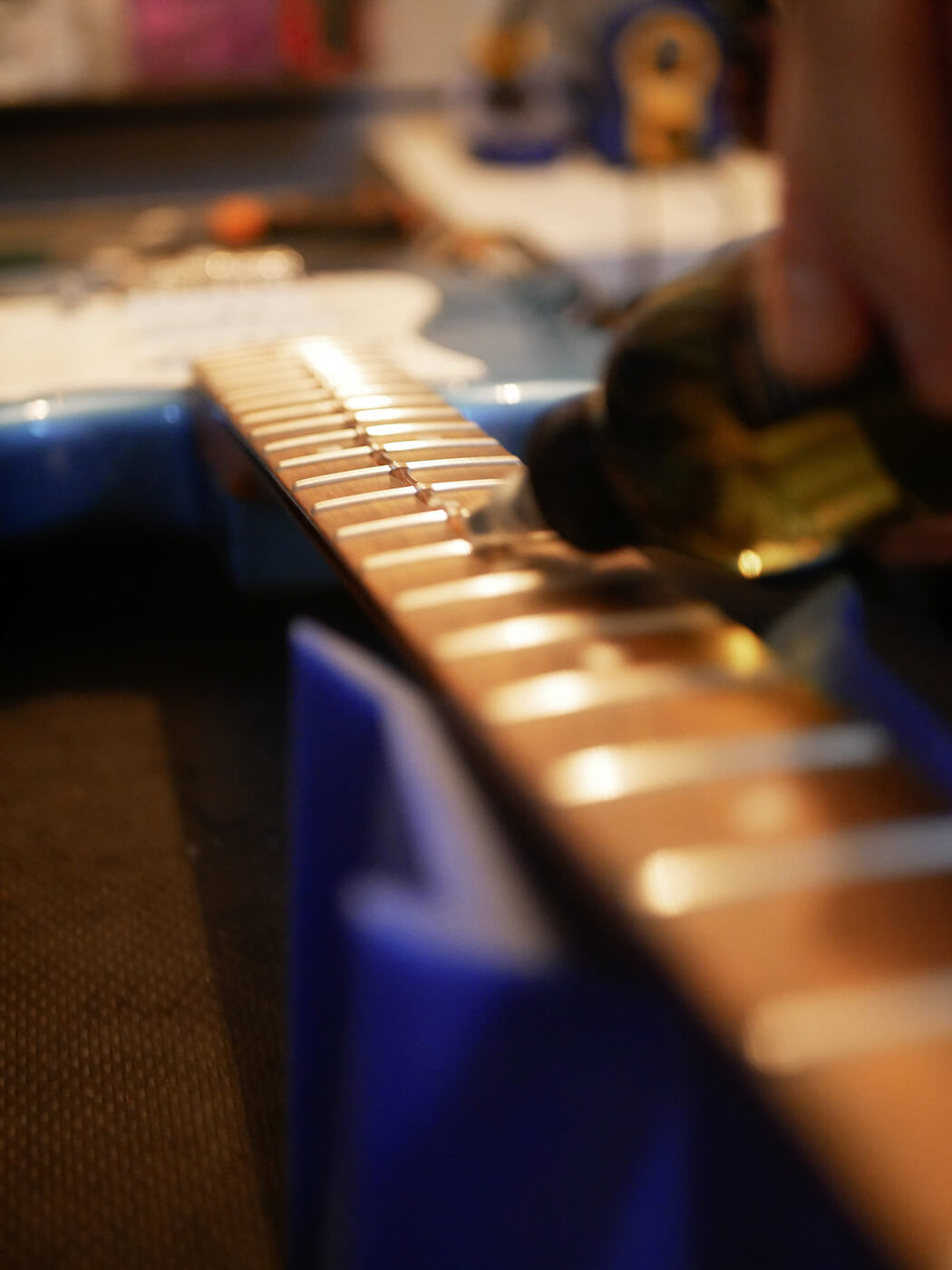 Close-up of a clean guitar pickguard after removing the plastic film, highlighting the result of careful preparation during the guitar setup process.