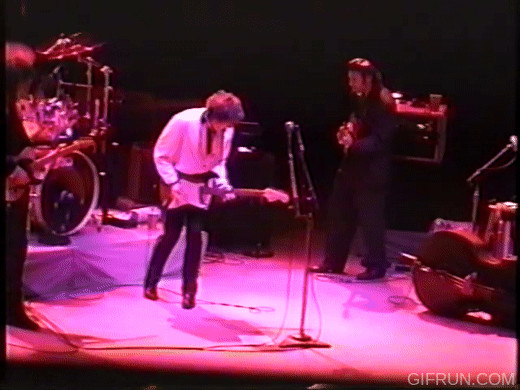 Bob Dylan guitar-solo soft-shoe foot shimmy pose