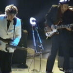 Bob Dylan's theatrical mid-solo knee bend guitar pose