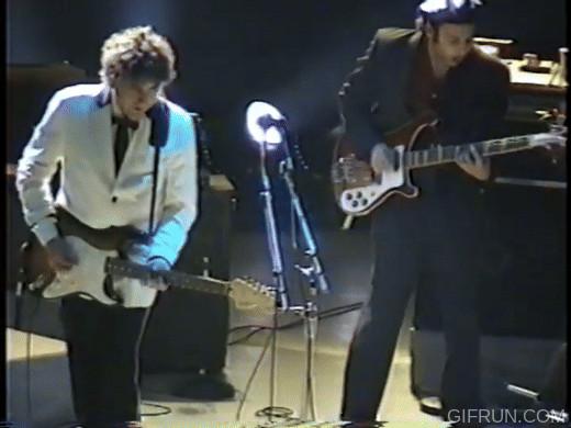Bob Dylan's theatrical mid-solo knee bend guitar pose
