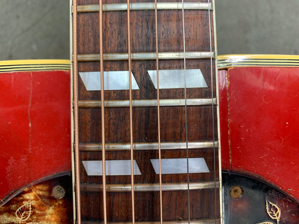 Close-up of the Gibson Dove's neck joint showing the misalignment
