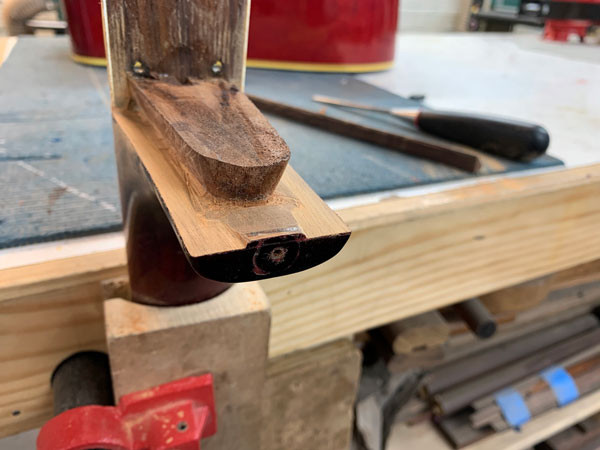 Material removed from the Gibson Dove neck heel for angle adjustment