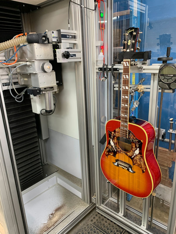 PLEK machine analyzing the Gibson Dove's fretboard