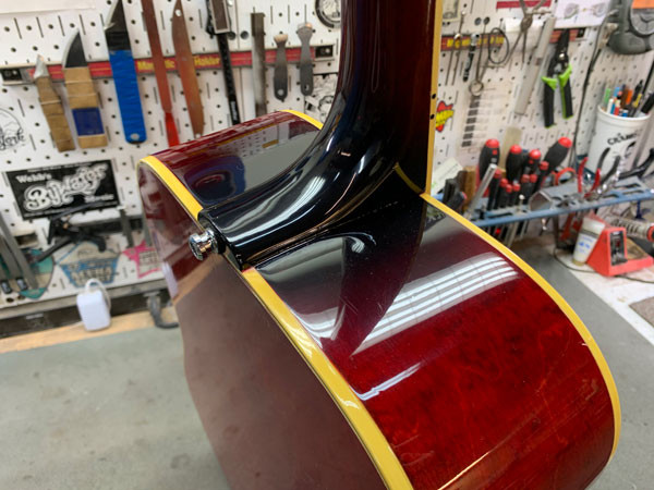 Angled view of the restored Gibson Dove showcasing its finish