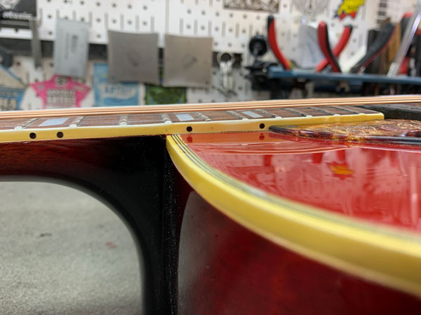 Close-up of the restored Gibson Dove headstock and neck