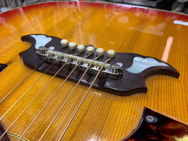 Detail of the restored Gibson Dove body and pickguards