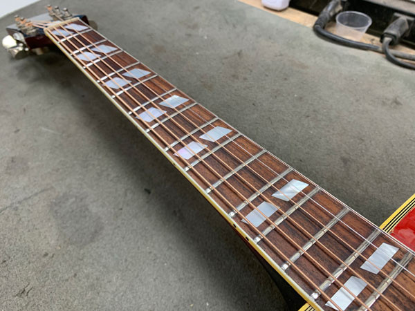 PLEK machine leveling the frets of the Gibson Dove guitar